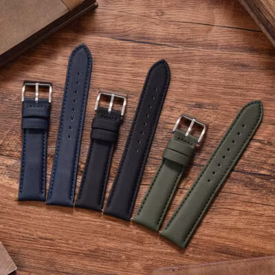 All three color options of the 20mm and 22mm quick-release leather sailcloth watch strap: black, navy blue, and olive green.