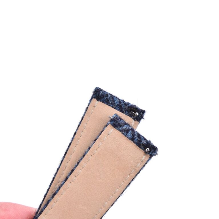 Back view of tweed woven wool watch strap showing smooth leather backing and quick-release spring bars.