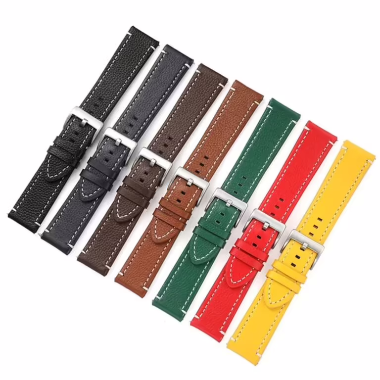 Variety of premium textured leather watch straps with white stitching on a white background.