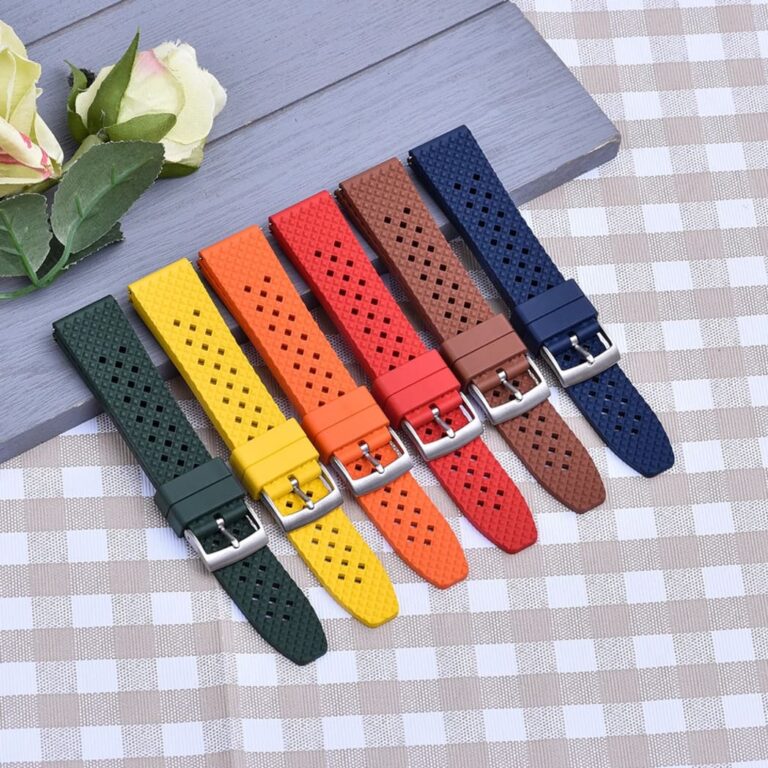 Collection of seven colorful tropical FKM watch straps on display.